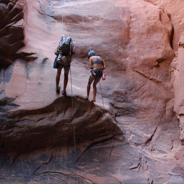 2 people rock climbing
