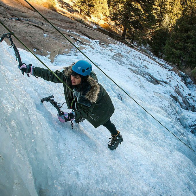 Girl ice climbing