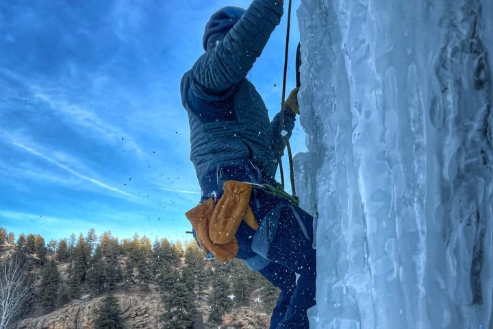 a man riding a snow board in the air