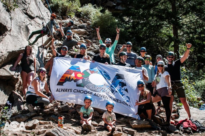 a group of people that are standing in the sand