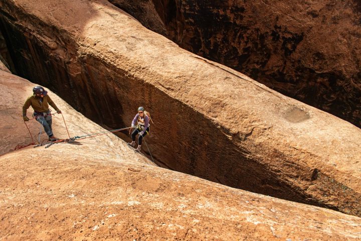 a man riding a bike down a dirt road