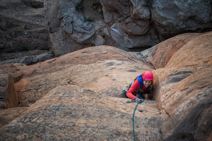 a man riding on top of a rock