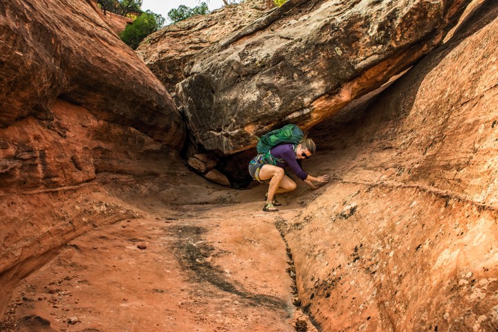 a man sitting on a rock