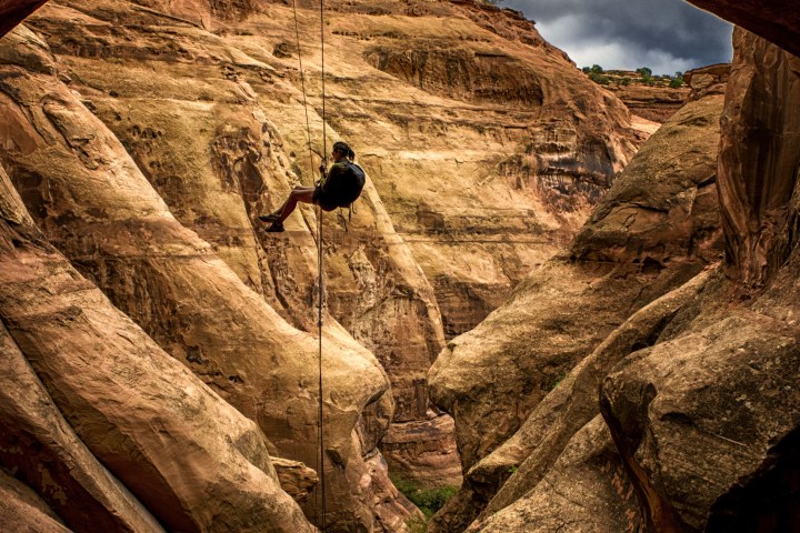 a person sitting on a rock