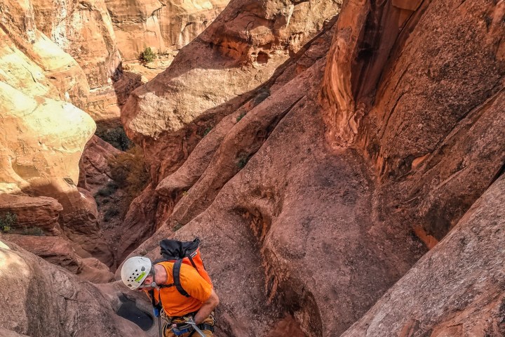 a person standing on a rocky hill