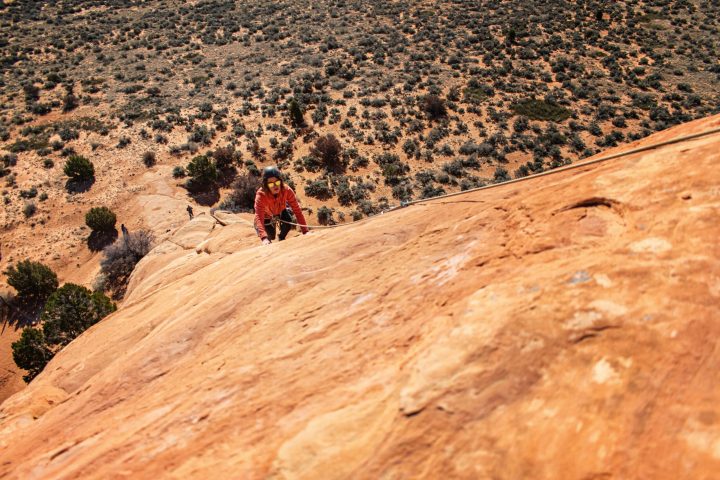 a person riding a bike down a dirt road