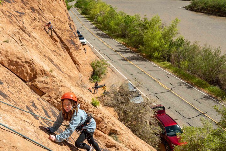 a person sitting on a rocky hill side