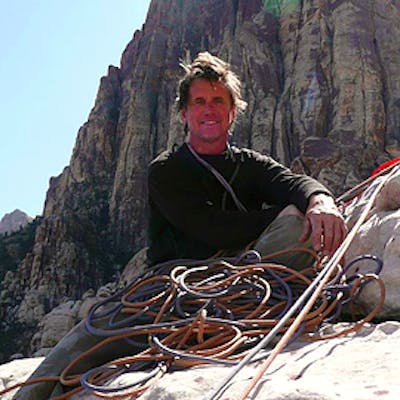 a man sitting on a rock