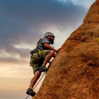 a man riding on top of a mountain