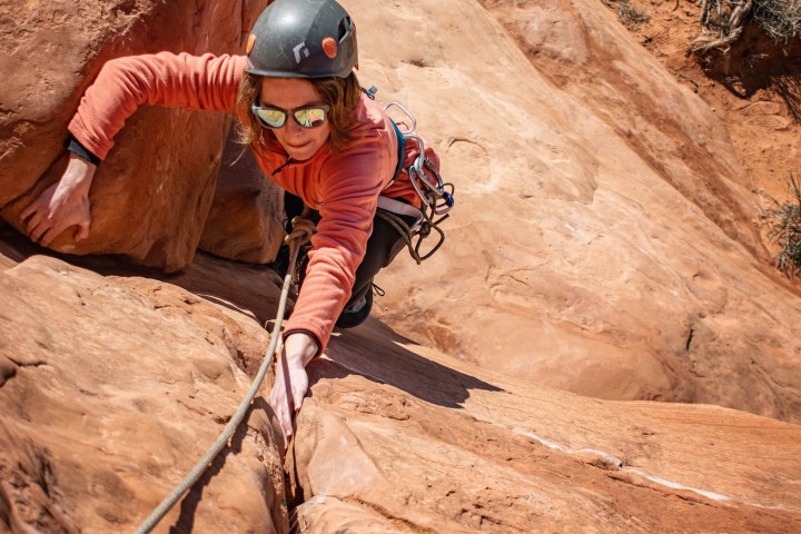 a man riding a bike down a dirt road