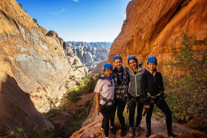 a man standing on a rocky hill