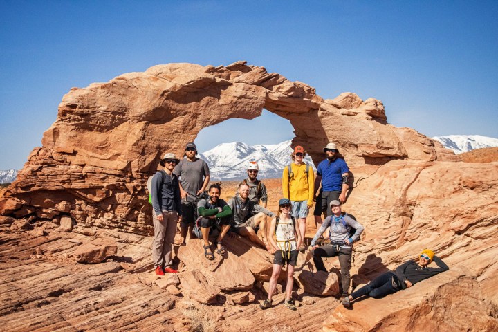 a group of people on a rocky hill