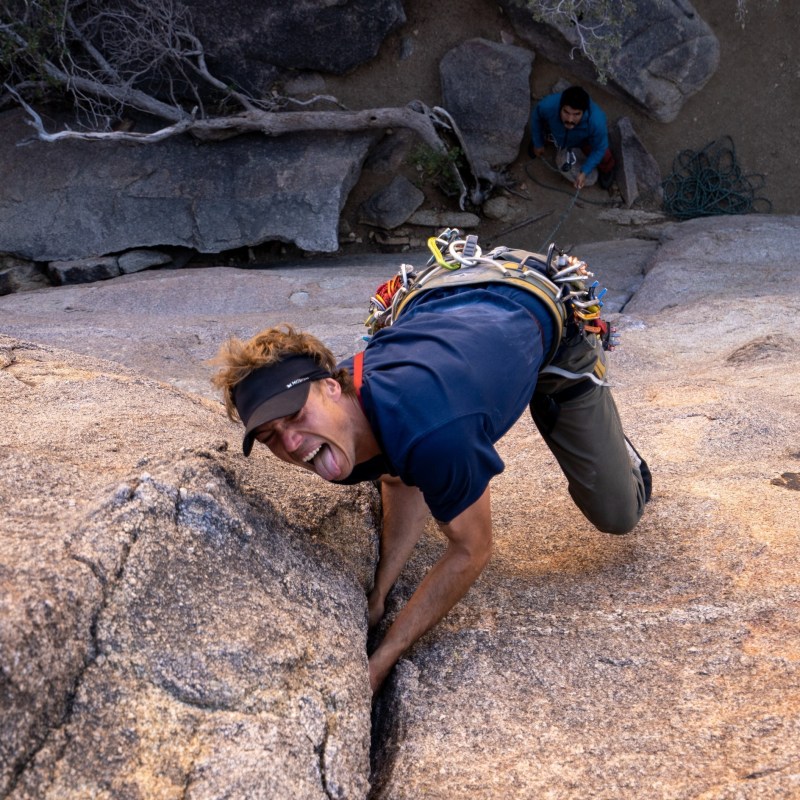 a man lying on a rock